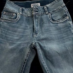 THEY ARE Flare, tight, blue jeans, flower prints on the back with diamonds .